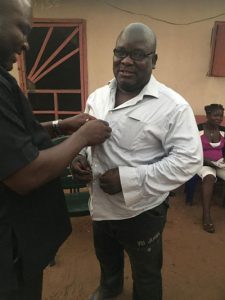 Chief Tony Amechi dressing up Roland Odalonunu